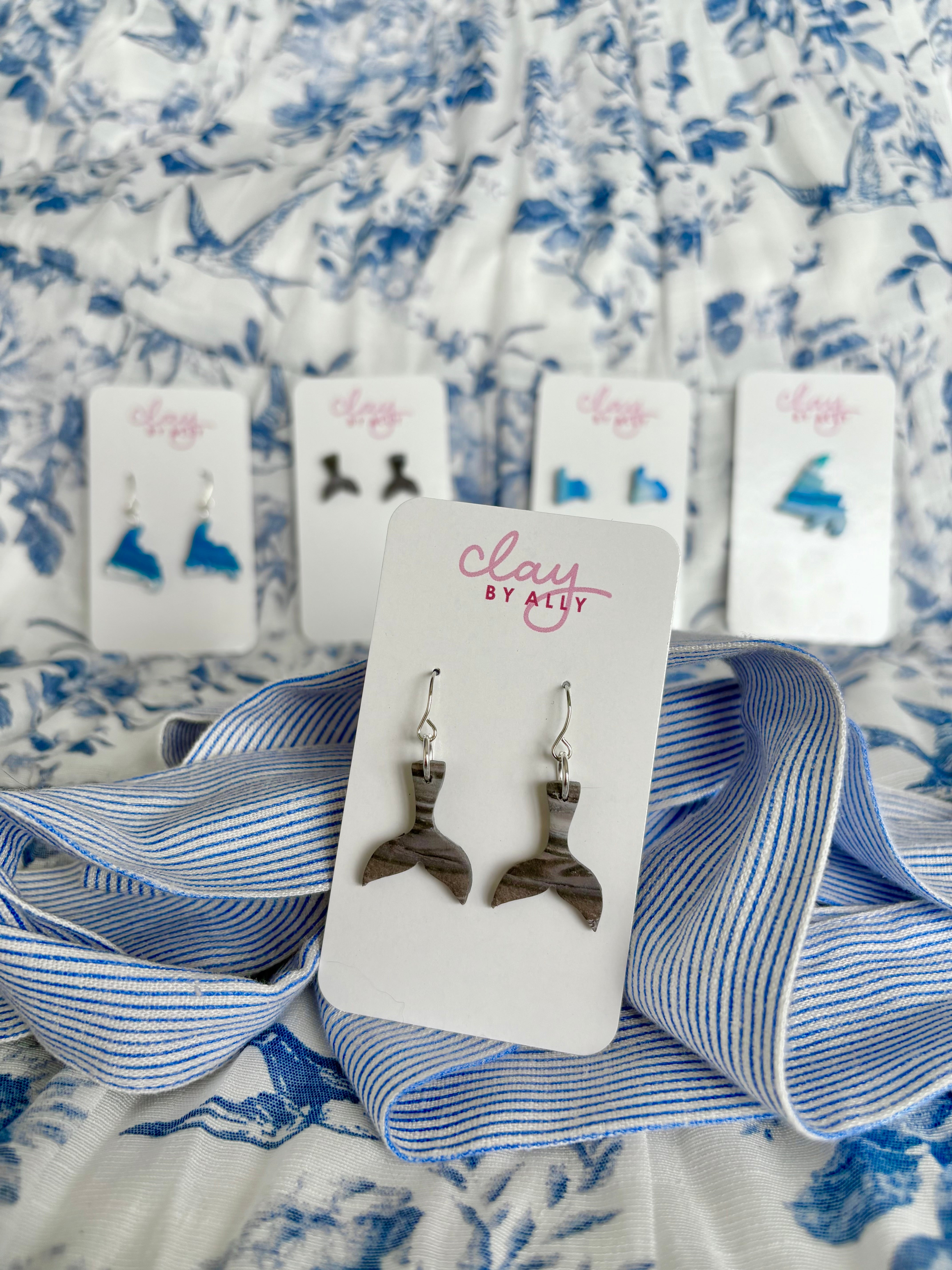 Whale tail dangles